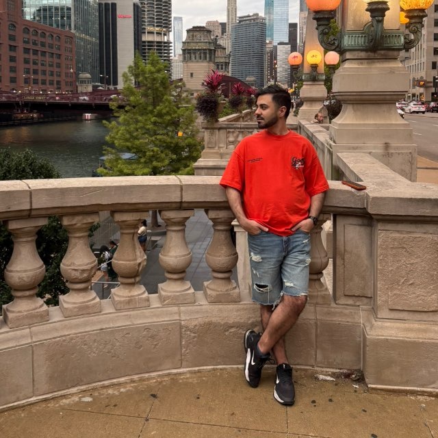 Arsham Ghavasieh standing beside the Chicago River